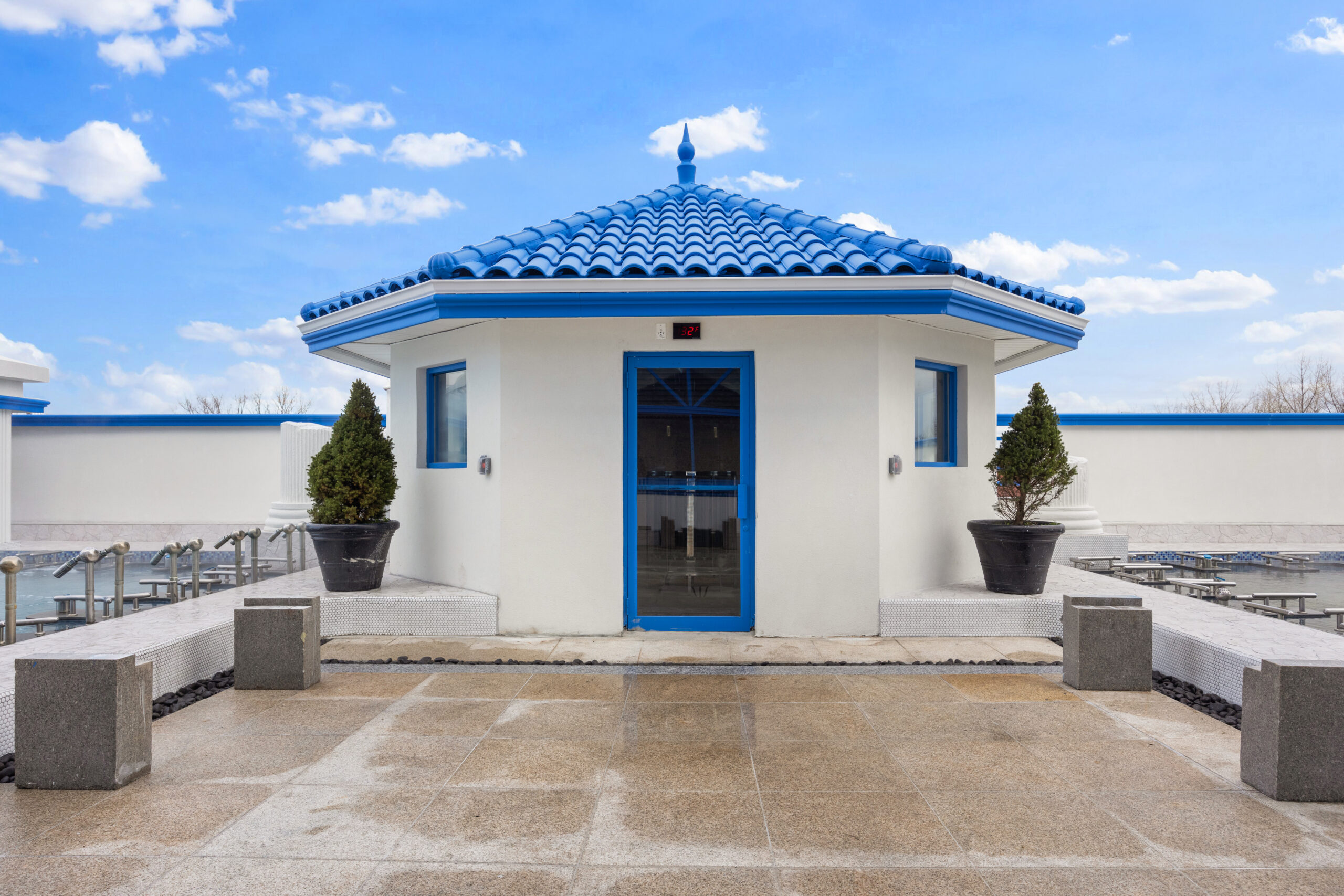 outside view of seasonal sauna room, located in the outdoor pool deck.