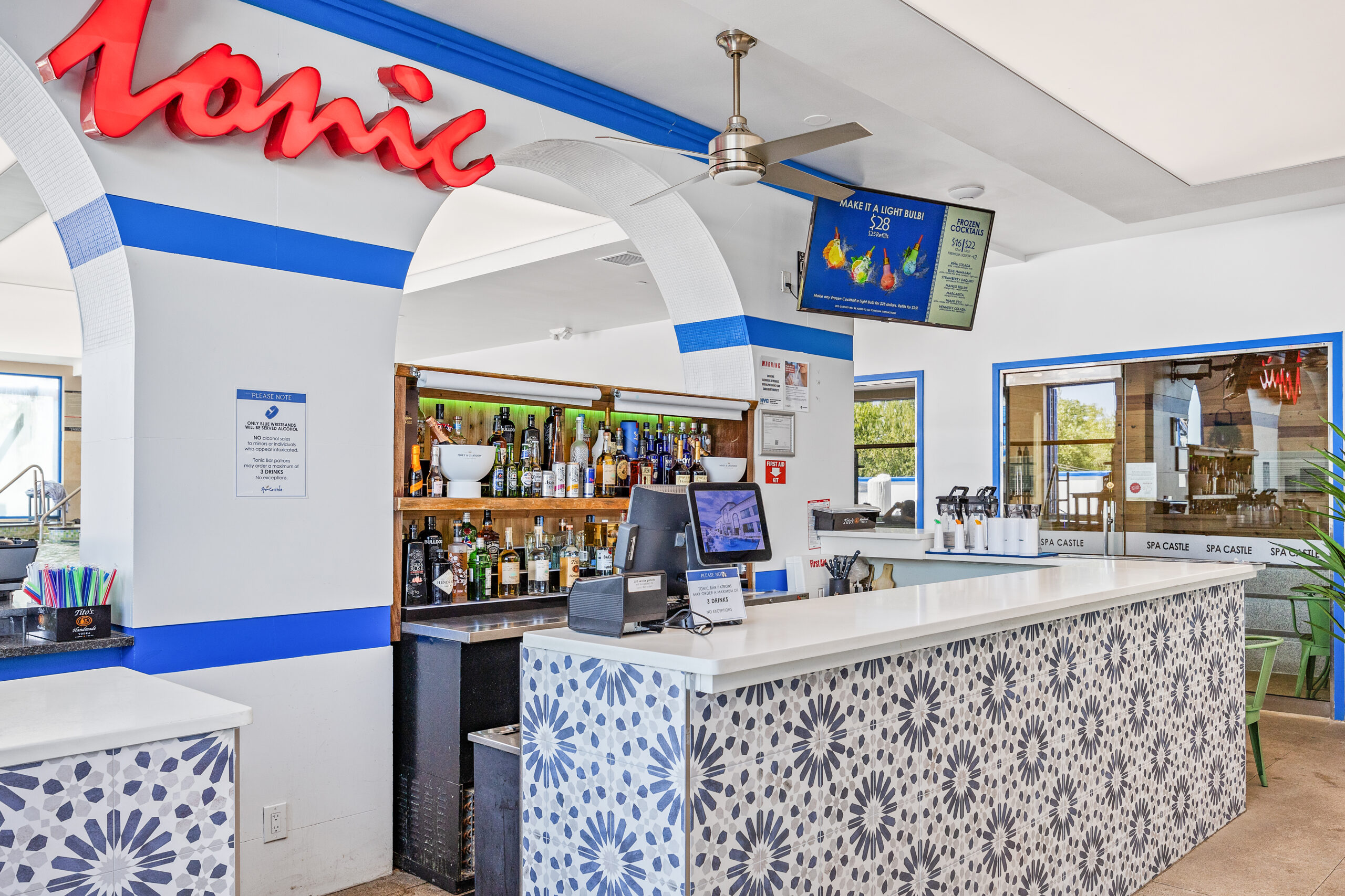 view of tonic bar, the aqua poolside bar. Displaying assortment of liquors.