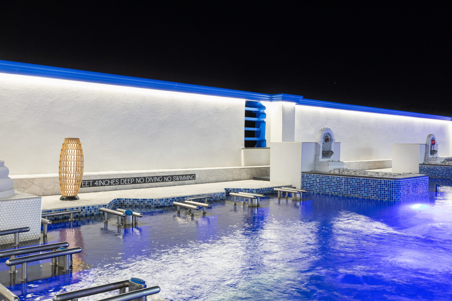 nighttime view of the outdoor standing medi pool. focusing on the hydro jet station.